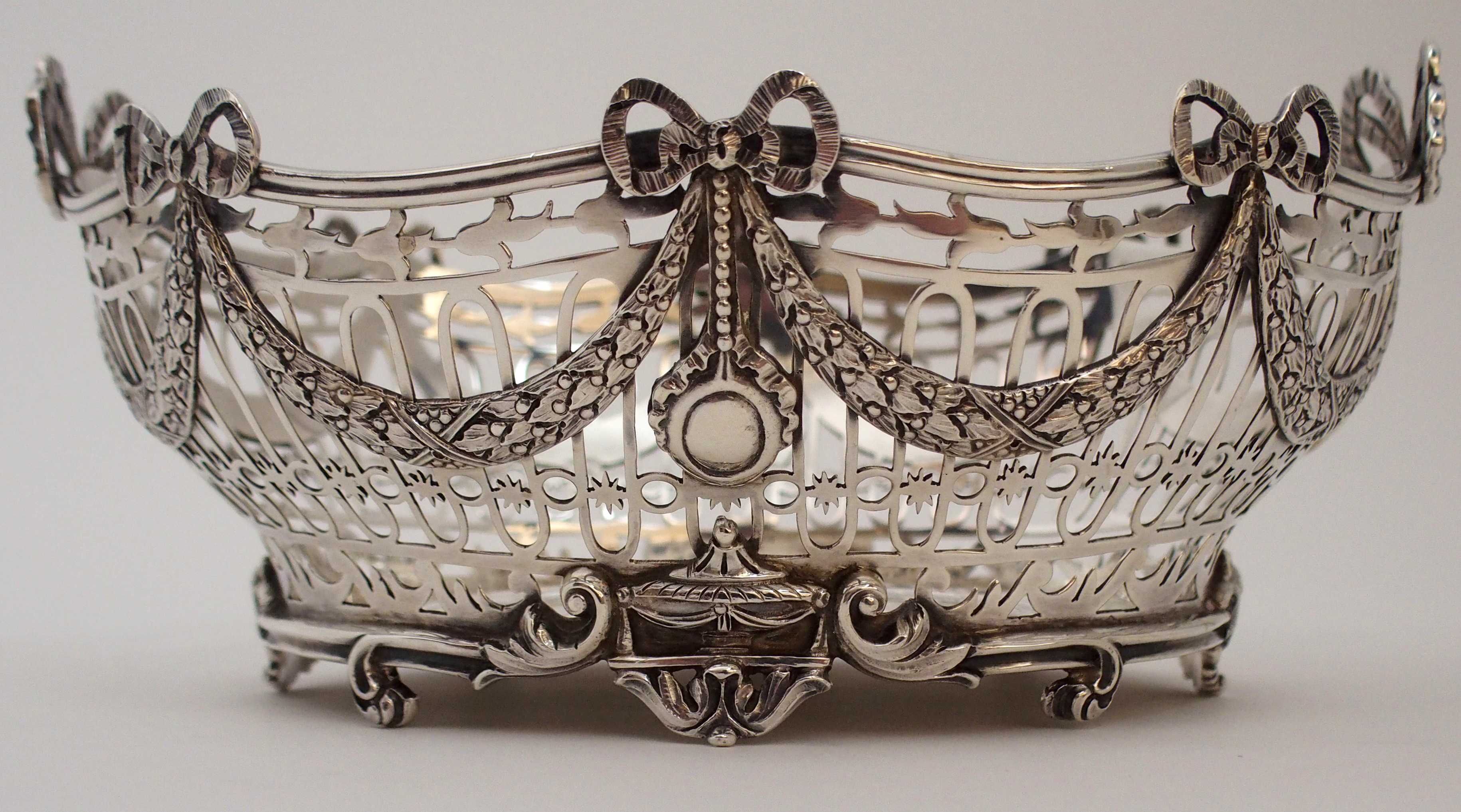 A SILVER BASKET by C. S. Harris & Sons Limited, London 1912, of oval form, the open strapwork body - Image 4 of 8