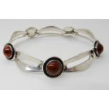 A DANISH SILVER BRACELET BT N.E. FROM SET WITH AMBERS with simple hook clasp, length 19cm, weight