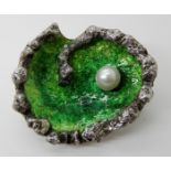A SPANISH SILVER DESIGNER MADE ROCKPOOL BROOCH enamelled in green and set with a pearl, made in