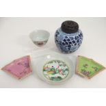 TWO CHINESE FAN SHAPED DISHES painted with flowers on a pink and green ground, 10.5cm wide,