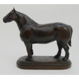 AFTER ISIDORE JULES BONHEUR - A BRONZE OF A WORKING HORSE modelled standing on textured ground,