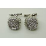 A PAIR OF DIAMOND SET CUFFLINKS the white metal stamped 750 (18k) pave set with estimated approx 1ct