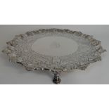 A GEORGE III SILVER SALVER by Elizabeth Cooke, London 1770, of circular form, the scalloped rim with