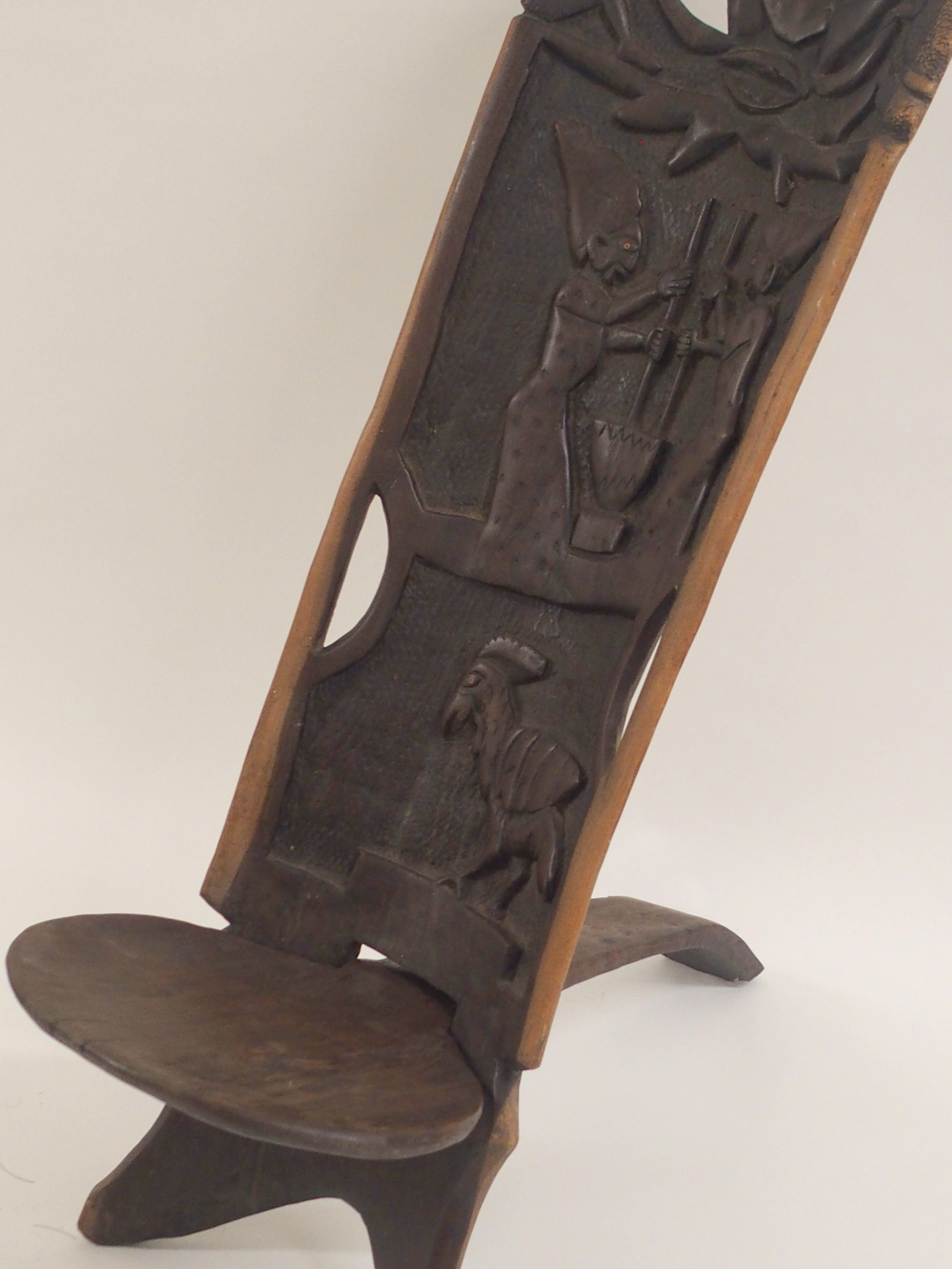 AN AFRICAN CARVED BIRTHING CHAIR the back with face mask flanked by two figures, above two women - Image 3 of 11