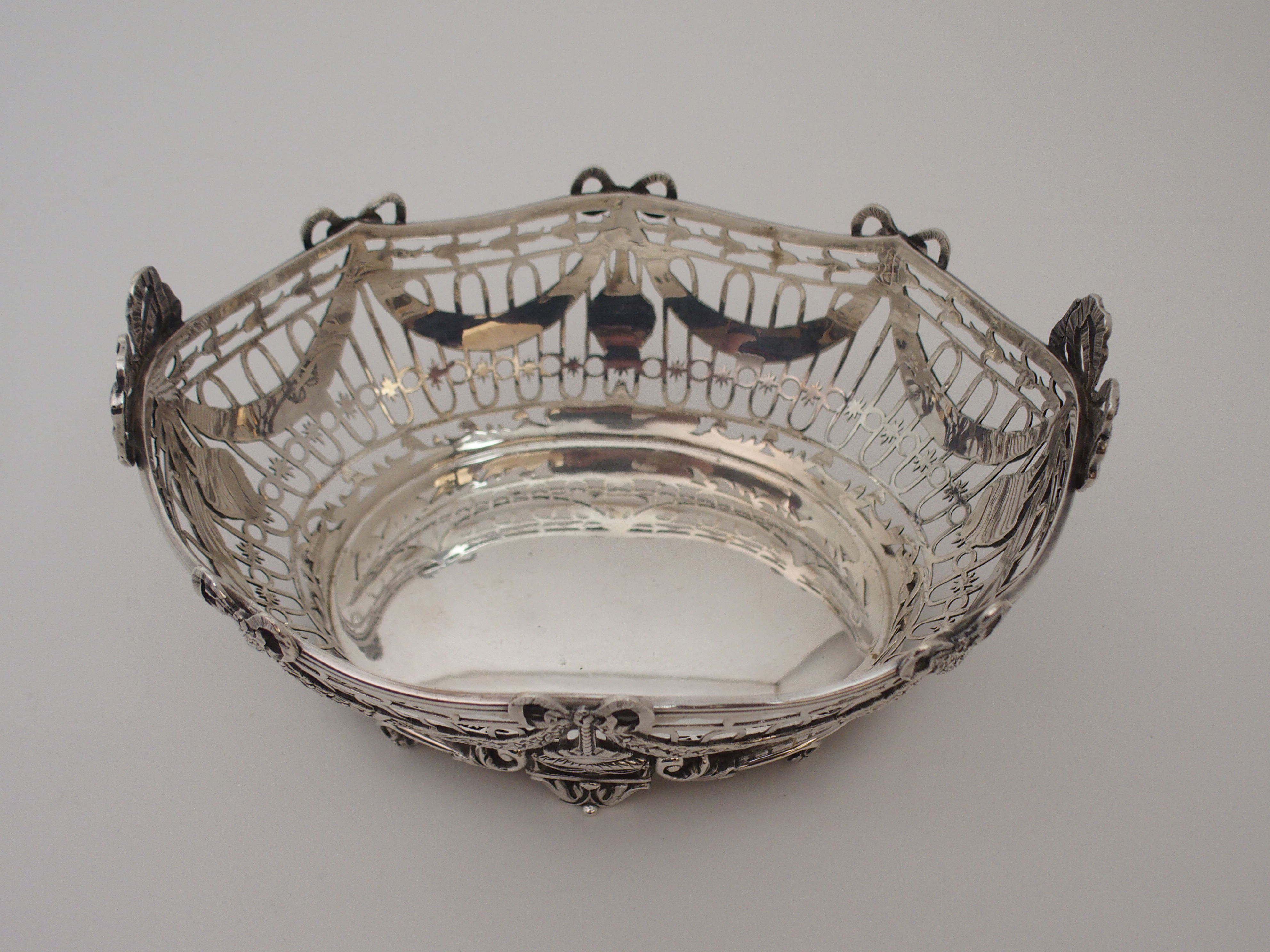 A SILVER BASKET by C. S. Harris & Sons Limited, London 1912, of oval form, the open strapwork body - Image 7 of 8