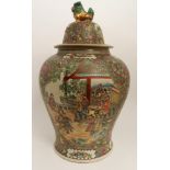 A LARGE CANTON JAR AND COVER painted with panels of figures and precious objects, gilt shishi finial