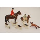 A BESWICK GROUP including a Huntsman on horse, a girl on Skewbald pony, four hounds and a fox (7)