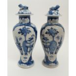 A PAIR OF CHINESE BLUE AND WHITE BALUSTER VASES painted with precious objects within mirror shaped