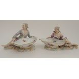 A PAIR OF LATE 19TH CENTURY MEISSEN FIGURAL SALTS modelled as a recumbent lady and gentleman, each