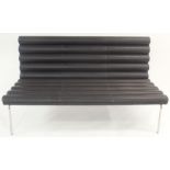 A SERGE CHERMAYEFF (1900 - 1996) STYLE BENCH with a fret leather tubed effect seat and back on