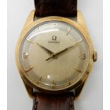 A 9CT GOLD GENTS OMEGA WRISTWATCH with two tone dial, gold Arabic numerals and batons, with brown