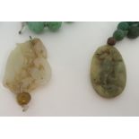 A CHINESE GLASS AND HARDSTONE NECKLACE the graduating glass beads with bird and serpent pendant,