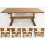 AN ALAN "ACORNMAN" GRAINGER OAK REFECTORY TABLE with adzed top on shaped supports joined by a