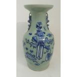 A CHINESE CELADON BLUE AND WHITE BALUSTER VASE moulded in relief with precious objects and with