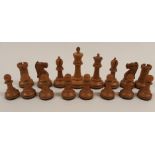 AN EBONY AND BOXWOOD STAUNTON CHESS SET with weighted bases, in original box, King 10cm high
