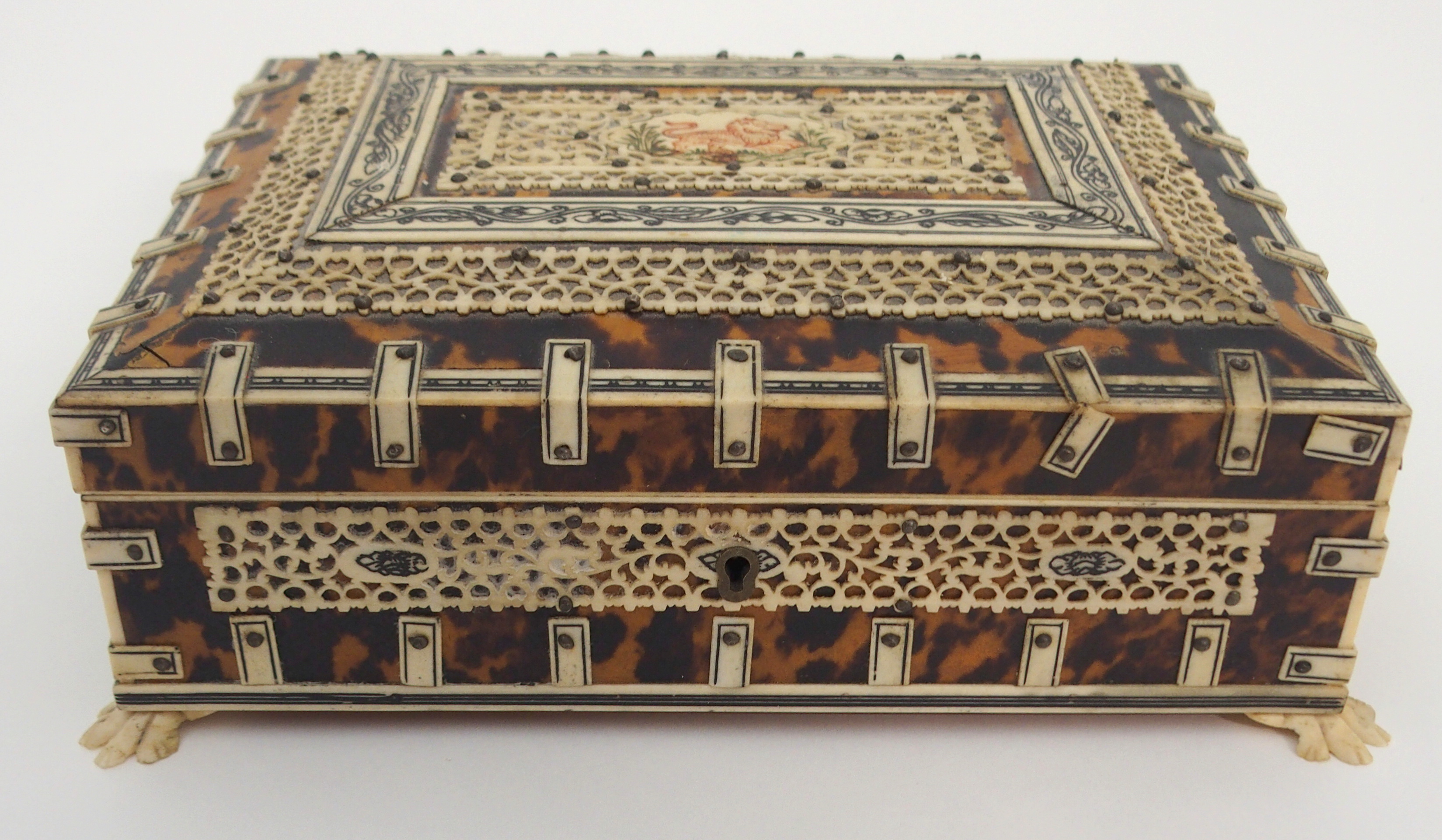 A VIZAGAPATAM JEWELLERY BOX the hinged cover with lion cartouche within pierced foliate bands, the