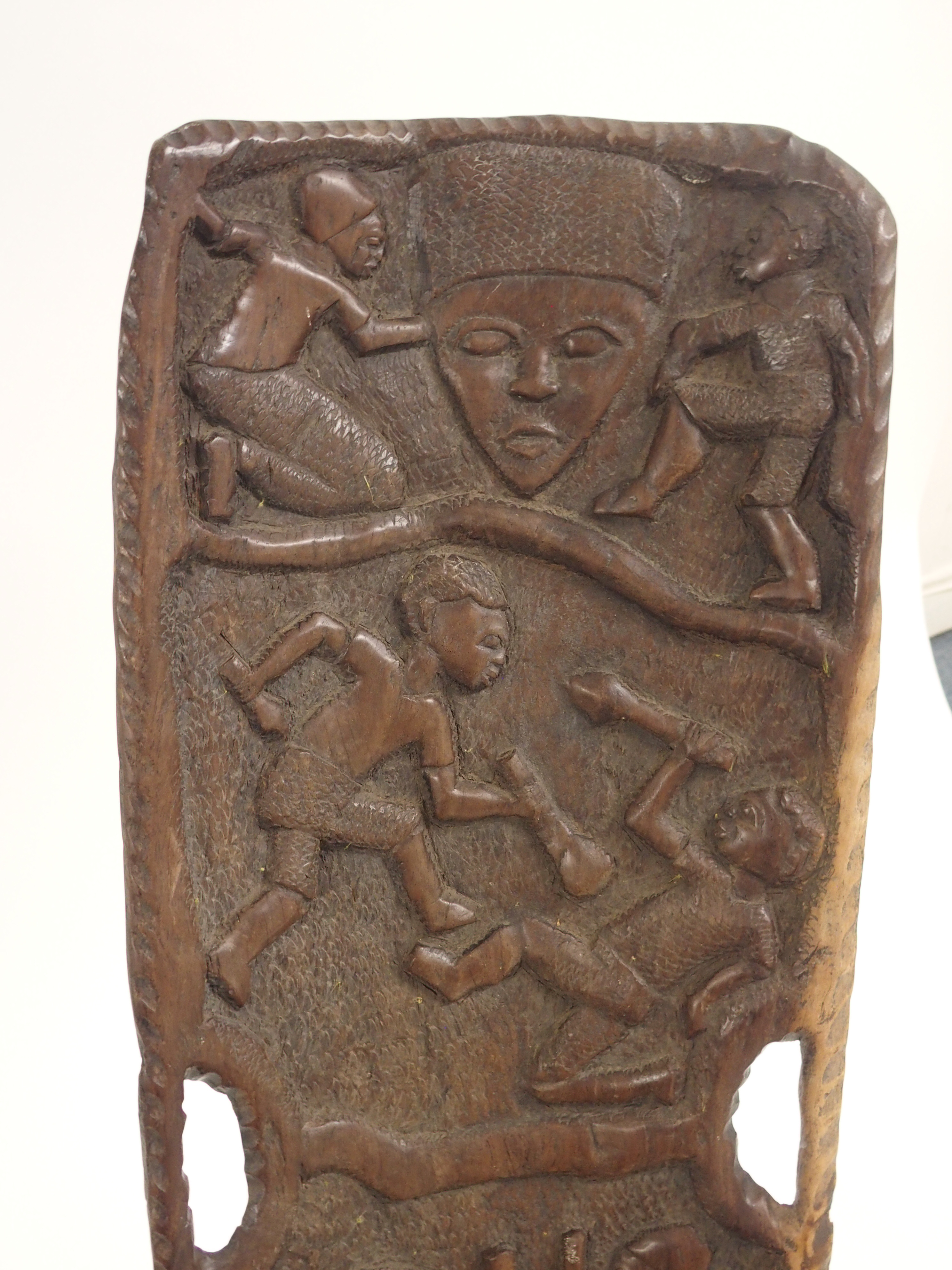 AN AFRICAN CARVED BIRTHING CHAIR the back with face mask flanked by two figures, above two women - Image 9 of 11