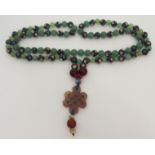 A CHINESE HARDSTONE AND CLOISONNE NECKLACE the beads interspersed and with knot pendant, 79cm long