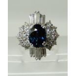 AN 18CT WHITE GOLD SAPPHIRE AND DIAMOND CLUSTER RING the sapphire measures approx 8.7mm x 6.7mm x