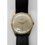 A GENTS 9CT GOLD OMEGA WATCH with cream brush textured dial gold baton numerals and subsidiary