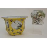 A CHINESE FAMILLE JAUNE HEXAGONAL PLANTER painted with panels of birds and foliage, amongst roundels