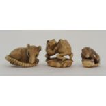 THREE JAPANESE IVORINE NETSUKE one as a rat holding a nut, signed, 3cm high, another chewing tail,
