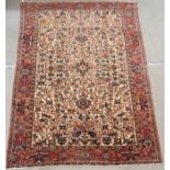 A CREAM GROUND HERIZ RUG with geometric designs in a red border, 333cm x 234cm Condition Report: