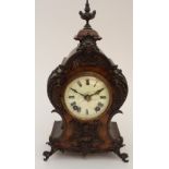 A FRENCH LOUIS XVI STYLE CLOCK the walnut case with bronzed mounts, the white enamel dial with roman