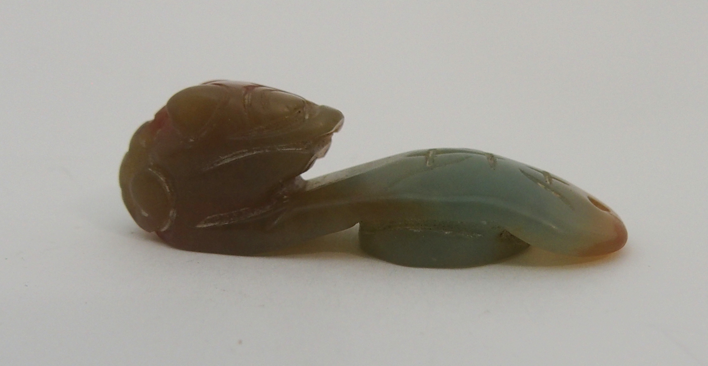 A CHINESE JADEITE BUTTON HOOK carved with a chilong head and engraved letter, 5cm long and two - Image 3 of 7