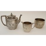 A VICTORIAN THREE PIECE SILVER TEA SERVICE maker's mark JR Glasgow 1886, of tapering cylindrical