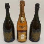 A BOTTLE OF LOUIS ROEDERER CRISTAL CHAMPAGNE, 1990 750ml, 12% vol, and two bottles of Dom Perignon