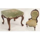 A VICTORIAN WALNUT BUTTON BACK NURSING CHAIR with foliate carved and pierced back above a serpentine
