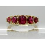 AN 18CT GOLD RUBY AND DIAMOND CLASSIC SCROLL MOUNT RING largest ruby approx 5.2mm x 4.8mm x 3.2mm,