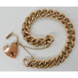 A 9CT ROSE GOLD VINTAGE CURB LINK BRACELET stamped 9ct to every link, with heart shaped clasp.