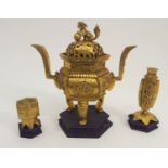 A CHINESE GILT BRONZE CENSER the pierced foliate cover mounted with Shishi with ball, the