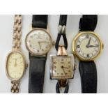 A 9CT GOLD LADIES ROTARY QUARTZ WATCH AND THREE OTHER WATCHES the rotary with gold coloured oval