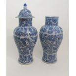 A PAIR OF CHINESE BLUE AND WHITE MOULDED BALUSTER VASES AND A COVER painted with panels of flowers