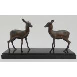 M. FONE - A SPELTER GROUP OF TWO DEER upon black slate base, 51cm long Condition Report: Available