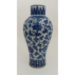 A CHINESE BLUE AND WHITE BALUSTER VASE painted with lotus and meandering foliage, within stiff