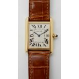 AN 18CT GOLD CARTIER TANK WATCH with white dial black Roman numerals and blued steel hands and