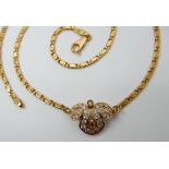 AN 18CT GOLD ITALIAN MADE YELLOW AND WHITE DIAMOND NECKLACE with a fancy link chain, the central