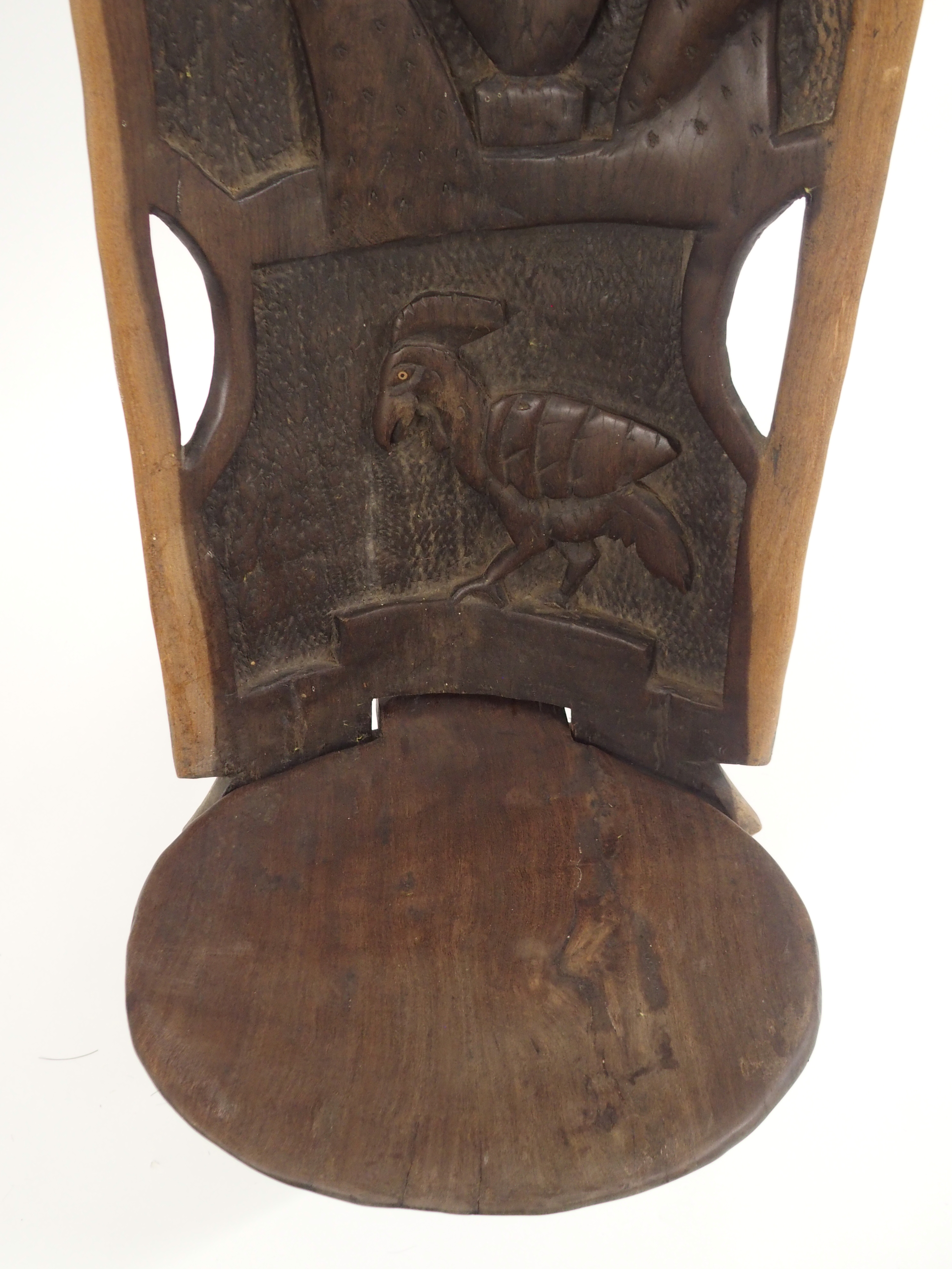 AN AFRICAN CARVED BIRTHING CHAIR the back with face mask flanked by two figures, above two women - Image 6 of 11