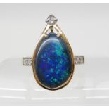 AN 18CT GOLD BLACK OPAL AND DIAMOND RING approximate dimensions of the opal 15.9mm x 10.8mm x 5mm,