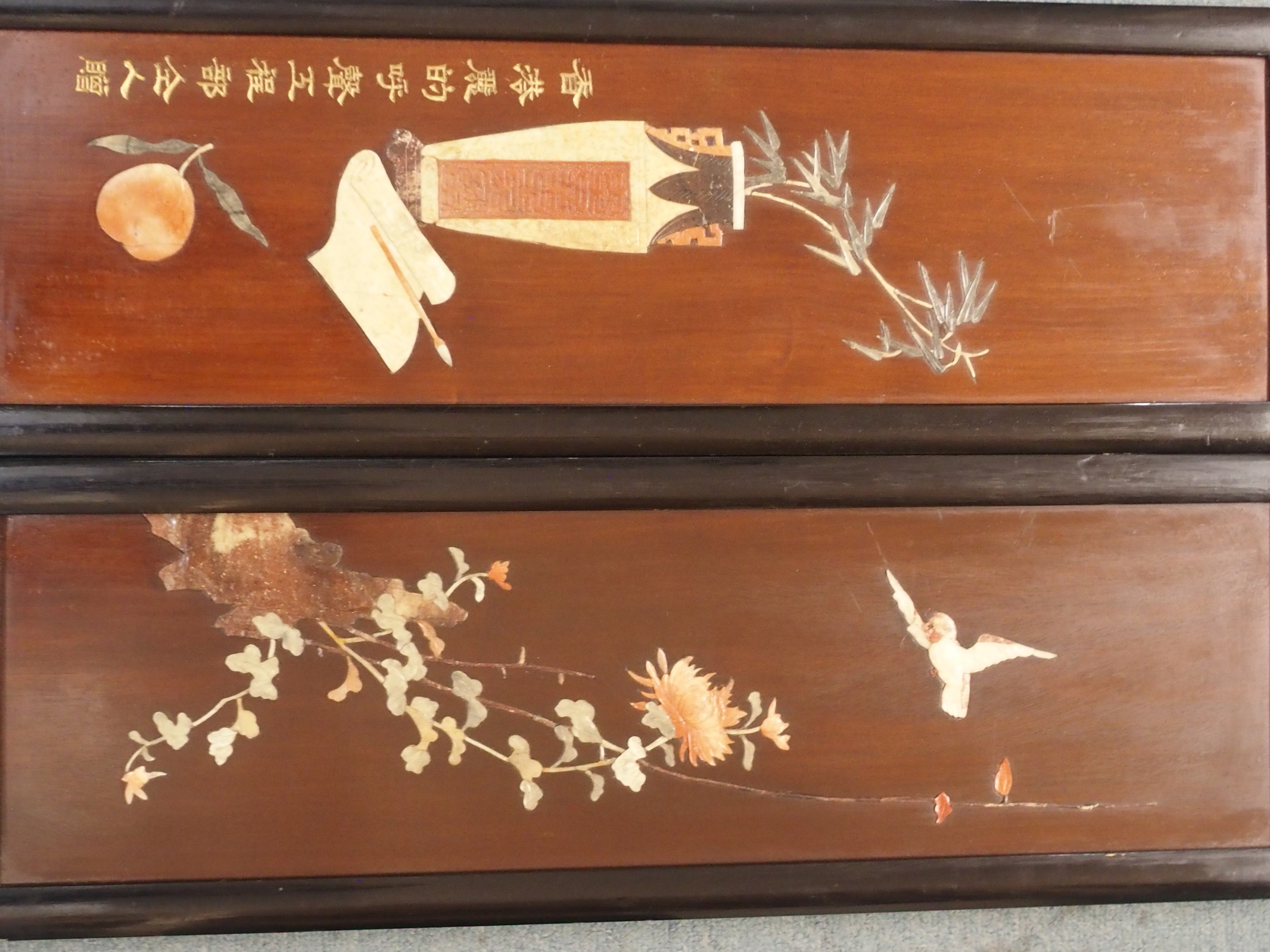 A JAPANESE FOUR FOLD LAQUERED SCREEN decorated with birds and precious objects in bone and hard