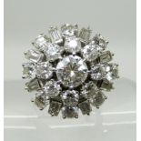 A SUBSTANTIAL DIAMOND CLUSTER RING the white metal mount set with estimated approx 3.87cts of