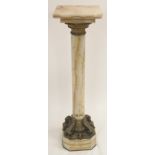 AN ONYX AND BRASS MOUNTED PEDESTAL the rotating square top above a plain column on octagonal base,