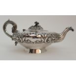 AN EARLY VICTORIAN IRISH SILVER TEAPOT by James Fray, Dublin 1838, the squat spherical body with