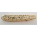 AN INUIT WALRUS TUSK CRIBBAGE BOARD the top with twelve pierced marker sections, divided by Eskimos,