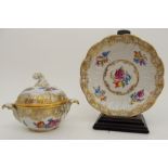 A DRESDEN BONBON DISH, WITH LID AND STAND handpainted with flowers within a gilt scrolling border,