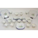 A 1930'S SHELLEY QUEEN ANNE SHAPE TEASET decorated with a lake, balcony and butterflies,